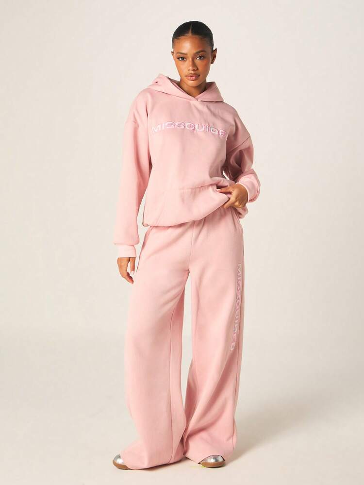 MISSGUIDED Pantalones de chándal rosas para mujer con raya lateral con logotipo, pantalones anchos de felpa para estar en casa de forma casual