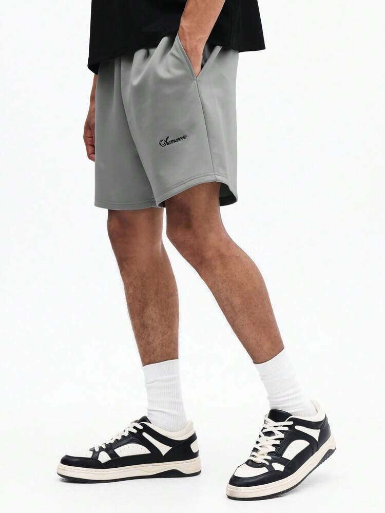 Męskie, zielone, neoprenowe spodenki do połowy uda, z kieszeniami bocznymi i elastycznym pasem, idealne na letnie, codzienne wyjścia