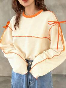 FRIFUL Áo thun dài tay nữ dáng rộng cổ tròn phối màu tương phản có nơ - Màu be - Xem 2