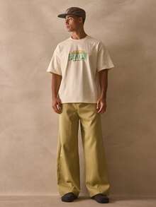 Musero Crew Neck Oversized Short Sleeve Drop Shoulder Top "HEAVEN Sent" Graphic Slogan Print Tshirt Spring Summer Essentials - Apricot - View 1