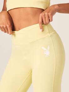 Missguided x Playboy High Rise Cross Over Waist Flared Leggings With White Bunny Logo For Activewear - Yellow - View 4