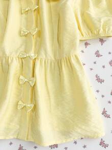 Elamini 女士泡泡袖衬衫，饰有黄色蝴蝶结，A字版型，彼得潘领，春夏款，波西米亚海滩风，甜美可爱，适合度假、返校、休闲等各种场合，百搭单品。 - 黃色 - 查看 4