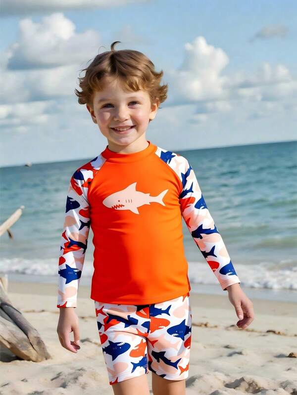 SHEIN Fantacosmos Young Boys Swimwear Cartoon Multi-Color Shark Cartoon Pattern Knitted Fabric, Shark + Shoulder Strap Long-Sleeved Sun Protection Two-Piece Set, Two-Piece Top + Four-Corner Pants, Fashionable, Casual, Exquisite, Elegant And Ladylike, Suitable For Swimming, Suitable For Summer Vacation, Summer Beach, Seaside, Swimming Pool, Summer Party, Leisure Vacation Sharks Pajamas Kids Boys Rash Guard Set Boys Long Sleeve Swimsuit Toddler Swim Shirt
