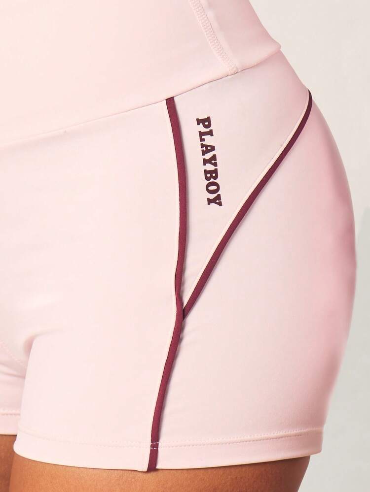 Missguided x Playboy 女性用ハイライズピンクアスレチックショーツ、コントラストパイピング、ロゴブランディング、ジムワークアウトアクティブウェアボトムス