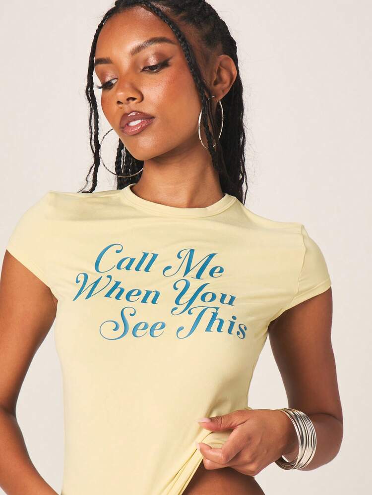 MISSGUIDED Women's Call Me When You See This Baby Tee Short Sleeve Crew Neck Fitted Yellow T-Shirt With Text Print Casual Top