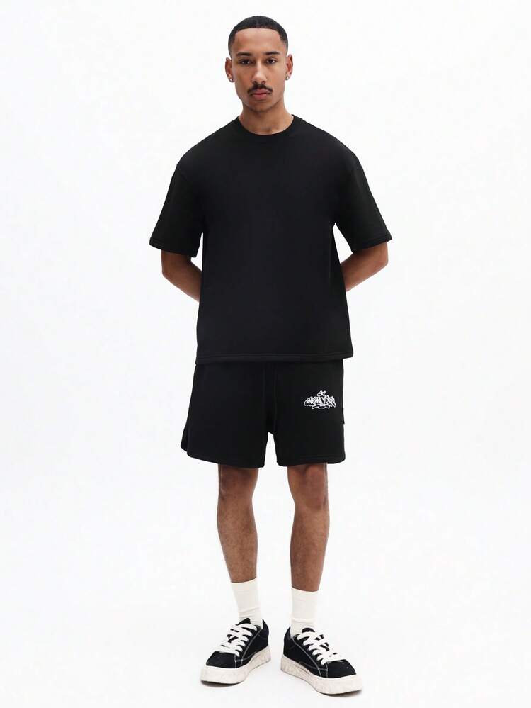 オーバーサイズブラックTシャツとショーツのコーディネートセット、グラフィティニューヨークバックプリントクルーネック半袖、夏のツーピースアウトフィット