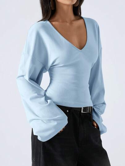 LYSMO This 2026 Minimalist Women's Spring Casual Versatile Solid Color Bell-Sleeve Shirt Is Suitable For Commuting, Christmas, New Year, Thanksgiving, Graduation Ceremonies, And Other Occasions. It Is Elegant And Stylish, Perfect For A Casual Home Wear. The Deep V-Neck Design And Blue Color Make It Comfortable And Relaxing.