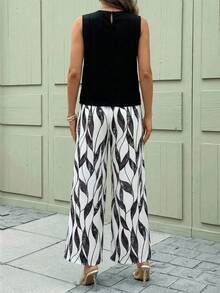 SHEIN Clasi Bộ đồ nữ thanh lịch gồm áo sơ mi xếp ly màu trơn và quần ống rộng in họa tiết cây cỏ, set 2 món mùa hè cho nữ, trang phục mùa hè cho nữ, bộ đồ phối váy và áo mùa hè cho nữ, bộ quần áo nữ. - màu đen - Xem 10