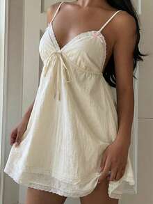 SHEIN EZwear 夏季梭织女式A字吊带蕾丝蝴蝶结迷你连衣裙娃娃裙可爱连衣裙白色连衣裙吊带裙奶油色连衣裙夏季连衣裙蕾丝边连衣裙吊带裙短款女装连衣裙女士夏季连衣裙女士夏季套装女士夏季服装度假服装女装 - 米色 - 查看 3