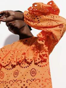 Aveloria Modichic Bright Orange Hollow Embroidered Blouse, Laser Cut Craftsmanship, Vibrant Orange Tone, Bohemian Style, Round Neck Layered Ruffle Trim, Long Sleeve With Elastic Cuffs, 3D Floral Embroidery Elements, Sheer Lightweight Fabric, Fitted Cropped Silhouette, Suitable For Spring/Summer Outdoor Music Festivals, Vacations, Art Exhibitions And Fashion Parties, Highlighting Lively And Unique Personalized, With Visual Impact And Comfort - Orange - View 4