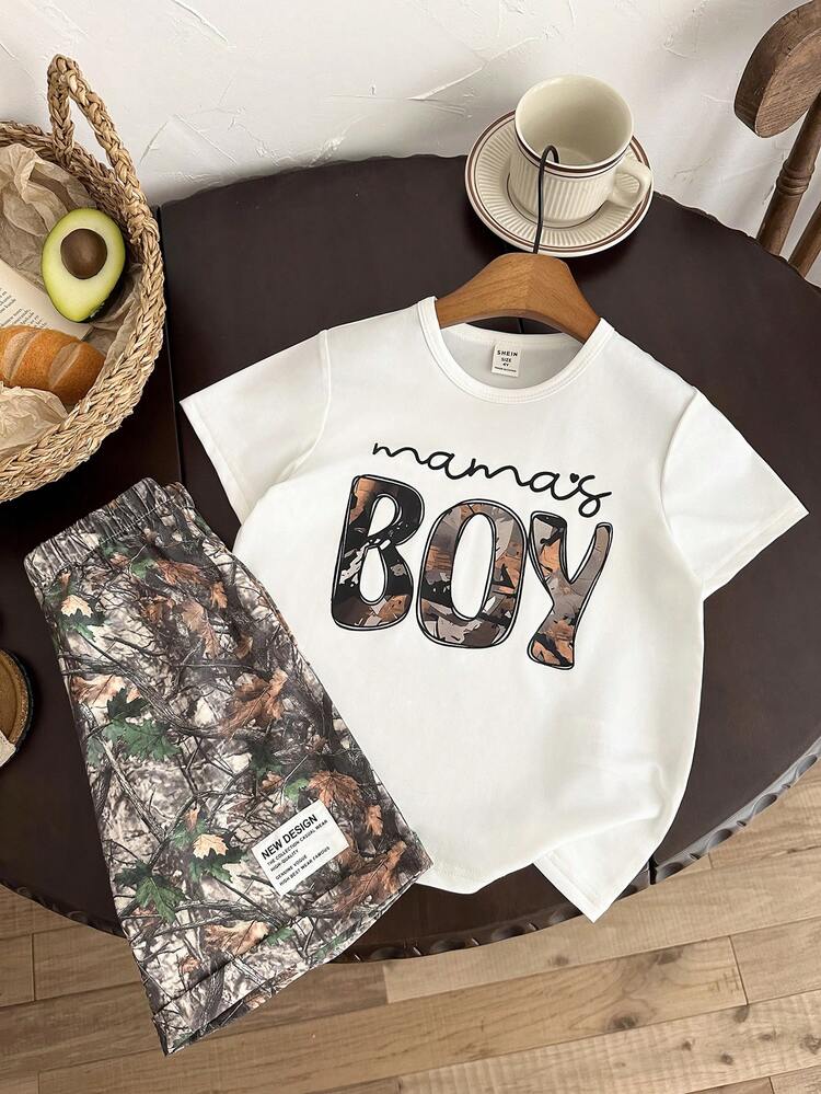 SHEIN Bộ 2 món cho bé trai, gồm áo thun cổ tròn tay ngắn màu trắng in chữ và quần short in họa tiết lá cây, thoải mái, đa năng, phù hợp cho mặc hàng ngày, đi chơi, hoạt động ngoài trời, kỳ nghỉ, du lịch biển, mùa xuân/hè. - Màu Khaki - Xem 9