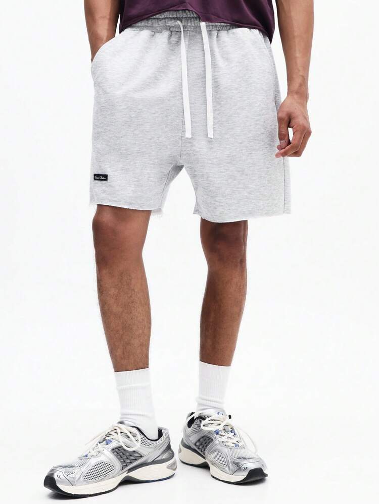 Pantaloncini in jersey mélange con coulisse e tasche laterali