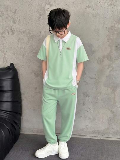 Vacaura 2pcs Boys' Casual Polo Shirt And Pants Set, Minimalist Design. Shirt With Contrast Color Panels And Woven Label, Pants With Color Block And Tapered Leg, Comfortable Fabric, Suitable For Summer And Autumn