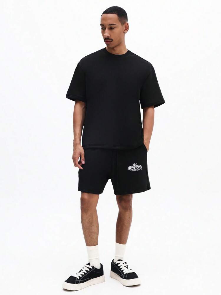 オーバーサイズブラックTシャツとショーツのコーディネートセット、グラフィティニューヨークバックプリントクルーネック半袖、夏のツーピースアウトフィット