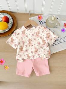 SHEIN Áo thun tay ngắn cổ tròn dáng rộng, màu trắng kem và hồng kem, họa tiết hoa phong cách Bohemian mùa xuân/hè, in hình thỏ nơ, kết hợp với quần short bó sát, thích hợp mặc hàng ngày, ở nhà, đi nghỉ mát, lễ Phục sinh, đi nông trại, hoạt động ngoài trời, dã ngoại cho bé gái mùa xuân/hè. - Nhiều màu - Xem 3