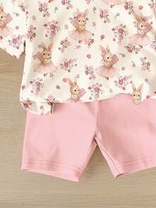SHEIN Áo thun tay ngắn cổ tròn dáng rộng, màu trắng kem và hồng kem, họa tiết hoa phong cách Bohemian mùa xuân/hè, in hình thỏ nơ, kết hợp với quần short bó sát, thích hợp mặc hàng ngày, ở nhà, đi nghỉ mát, lễ Phục sinh, đi nông trại, hoạt động ngoài trời, dã ngoại cho bé gái mùa xuân/hè. - Nhiều màu - Xem 6