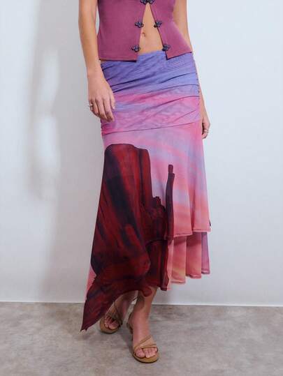 Nöista Low Rise Printed Skirt In Mesh Quality, Old West Inspired Print With Purple, Red And Orange Colors, Gathering On The Hip Area And Loose Fit.