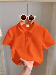1 件年轻男孩休闲运动橙色艺术复古纹理面料短袖 Polo 衫适合返校适合生日派对、晚会、表演、婚礼、洗礼、开幕式适合中东适合日常使用适合上学适合旅行适合运动适合春夏季节 - 橘色 - 查看 2