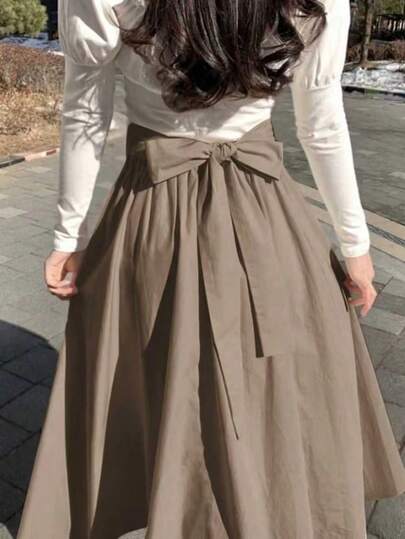 DAZY 女士纯色蝴蝶结腰部宽松A字裙，四季皆宜的秋季半身裙