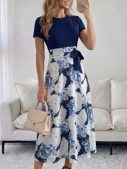 Miaspire This Elegant Women's Dress Features A Deep Navy Blue Base On The Upper Half, Paired With A Navy Blue Background And Blue And White Floral Print On The Lower Half. The Contrasting Colors Create A Romantic Atmosphere. The Floral Pattern Is A Full Peony Design, Rich In Detail And Full Of Vacation Vibes. The Dress Features A Round Neck, Short Sleeves, A High Waist With A Tie, And A Full Skirt. The Draping And Breathable Fabric Is Suitable For Various Occasions, And The Flowing Skirt Exudes Elegance. Perfect For Summer, It's Ideal For Beach Vacations, Outdoor Picnics, Or Romantic Dates. The Navy Blue Base Conveys A Sophisticated Style, While The Blue And White Print Showcases A Fresh And Fashionable Taste. It's A Great Choice For Your Vacation Wardrobe, Combining Style And Practicality.
