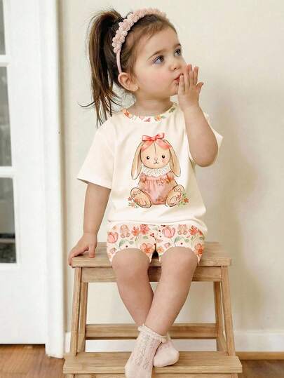 SHEIN LMoss Kids Beige Summer Cute Vacation Cream White 3D Bow Lace Skirt Rabbit Illustration Pattern Bohemian Floral Short Sleeve T-Shirt And Tight Cycling Shorts Set