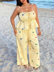 GalTyme 春夏新款休闲套装，适合外出、日常穿着、派对、音乐节、返校、毕业典礼、度假、街头风、居家休闲、逛街、城市漫步等多种场合，可单穿或叠穿。吊带上衣饰有荷叶边下摆，搭配宽松弹力腰裤，黄白条纹海洋元素贝壳和海星印花，大码两件套。 - 彩色 - 查看 3