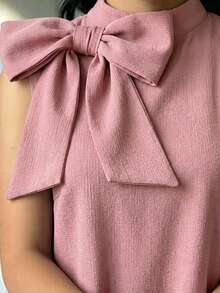 Set da 2 pezzi per ragazze pre-adolescenti, composto da top senza maniche con collo rotondo e decorazione fiocco 3D, e gonna, stile casual e minimalista, comodo - Rosa - Visualizzare 3