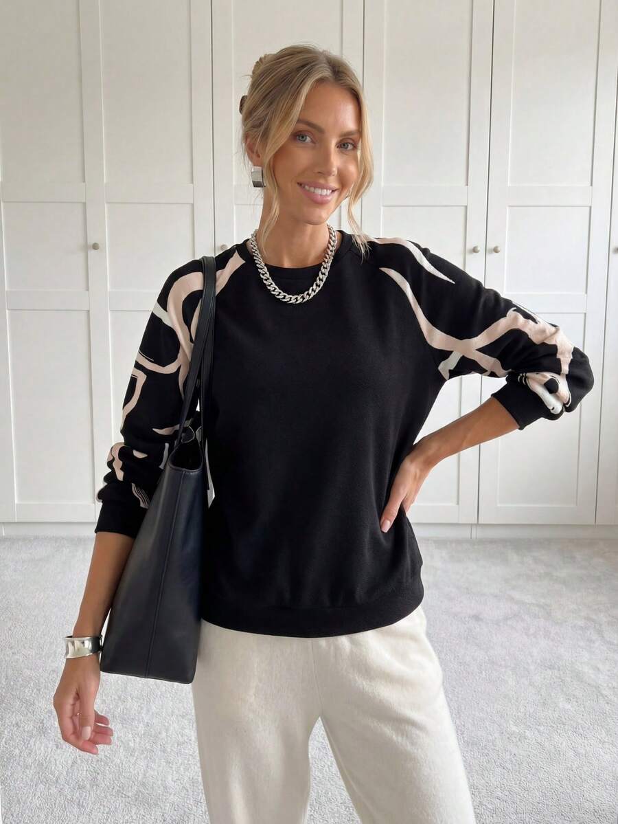 SHEIN LUNE Sudadera con estampado gráfico y mangas raglán, tops de manga larga para otoño/invierno, casual - Negro - Ver 1