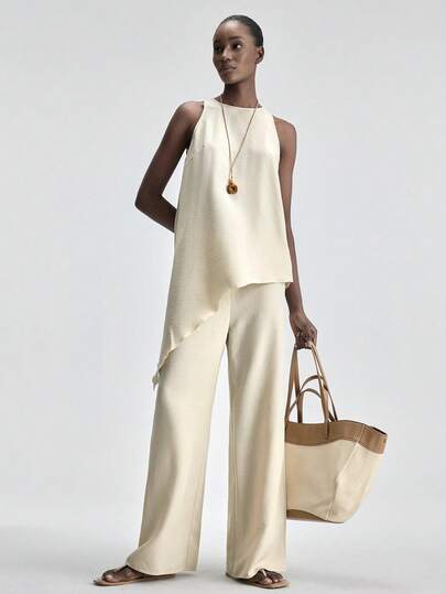 Ontre Conjunto de top y pantalones beige con bajo asimétrico para mujer, atuendo elegante y moderno para invitada de boda, minimalista y romántico estilo francés chic y lujoso para uso urbano, de oficina y casual, versátil y esencial para viajes, festivales y temporada nupcial.