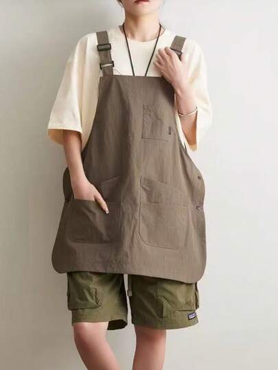 艺术创作围裙/工作服。可调节，多口袋，双面设计。耐用涤纶材质。适用于厨房、面包店、咖啡馆、摄影和居家环境。可作为多功能服装穿着。是居家、图书馆、餐厅、面包店、咖啡馆、厨房和多功能工作服的理想之选。