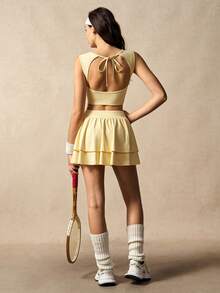 VARSIVA Bộ đồ thể thao nữ gồm áo tank top cổ tròn màu trơn và quần váy xếp ly. - Butter Yellow - Xem 6