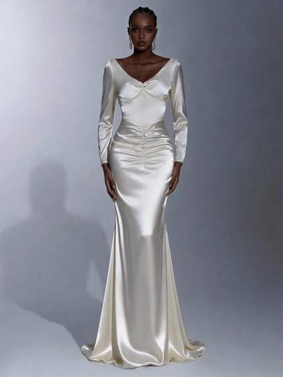 Elitara Elegant Minimalist Cream Satin Long Sleeve Pleated Front, Sexy Open Back Ruffle Trim Mermaid Hem Formal Gown, Evening Dress, Party Dress Long Sleeve Gown