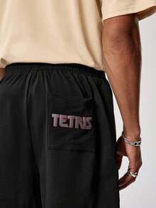 Tetris™ X SHEIN 男士几何印花松紧腰带口袋宽松休闲短裤 - 黑色 - 查看 3