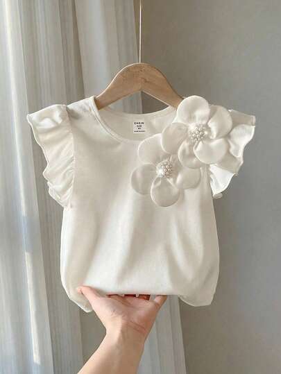 SHEIN Camiseta de manga corta y cuello redondo con decoración floral para niña