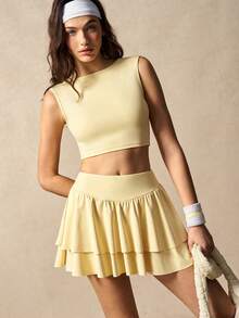 VARSIVA Bộ đồ thể thao nữ gồm áo tank top cổ tròn màu trơn và quần váy xếp ly. - Butter Yellow - Xem 7
