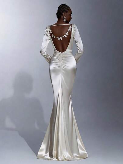 Elitara Elegant Minimalist Cream Satin Long Sleeve Pleated Front, Sexy Open Back Ruffle Trim Mermaid Hem Formal Gown, Evening Dress, Party Dress Long Sleeve Gown