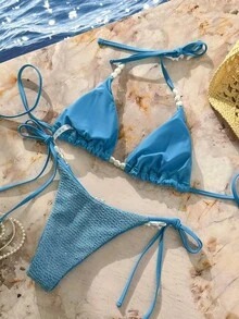 Vaytide Bộ đồ bơi 2 mảnh, với chất liệu vải lấp lánh, họa tiết ngọc trai, áo ngực tam giác cổ yếm và quần bơi buộc dây bên hông, bộ bikini gợi cảm cho kỳ nghỉ hè ở bãi biển. Bộ bikini đi nghỉ mát, bikini đính hạt, bikini vỏ sò, bộ bikini đi biển, bộ bikini cho nữ, bikini đính hạt, bộ 2 mảnh đi biển, trang phục đi nghỉ mát cho nữ, trang phục đi biển cho nữ, bộ hai mảnh cho nữ, trang phục lễ hội mùa hè cho nữ, trang phục dự tiệc, trang phục đi biển, bộ bikini cho nữ, đồ bơi 2 mảnh cho nữ. - Màu xanh lam - Xem 2