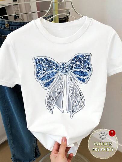 SHEIN Blusa de manga corta casual con cuello redondo y bordado de lazo para niña, adecuada para uso diario en verano, vuelta al colegio, combinación con hermanas, vacaciones