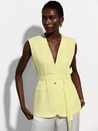 Aveloria Modichic Light Yellow Sleeveless Suit Vest, V-Neck Design, Tie Waist, Metal Button Detail, Tailored Underarm, Slim Fit, Smooth Fabric, Minimalist Modern Style, Suitable For Work, Business Meetings, Leisure, Spring/Summer, Emphasizing Capable And Elegant, Pair With Pants Or Skirts To Enhance Overall Chic And Sophistication. Commuter Delight Vest With Waist Tie And Fake Pockets, V-Neck Ladies Top