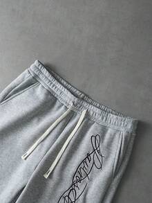 PAVTROS 男士街头风“标志性”手写休闲短裤，松紧腰抽绳设计，针织运动裤，极具辨识度的街头风格，轻便休闲，适合休闲、街头穿搭、时尚、休闲运动、返校、音乐节、情侣装、节日礼物、男友礼物等场合。 - 灰色 - 查看 4