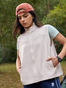 Exploreva Áo khoác gile nữ màu trơn có khóa kéo, kiểu dáng thường ngày đa năng, thích hợp mặc ngoài trời, tập yoga, leo núi, áo gile thể thao nữ, áo gile không tay, áo khoác yoga, áo gile leo núi, áo gile ngoài trời nữ, áo gile có khóa kéo, áo gile thể thao nữ, áo gile ngoài trời nữ. - Màu be - Xem 3