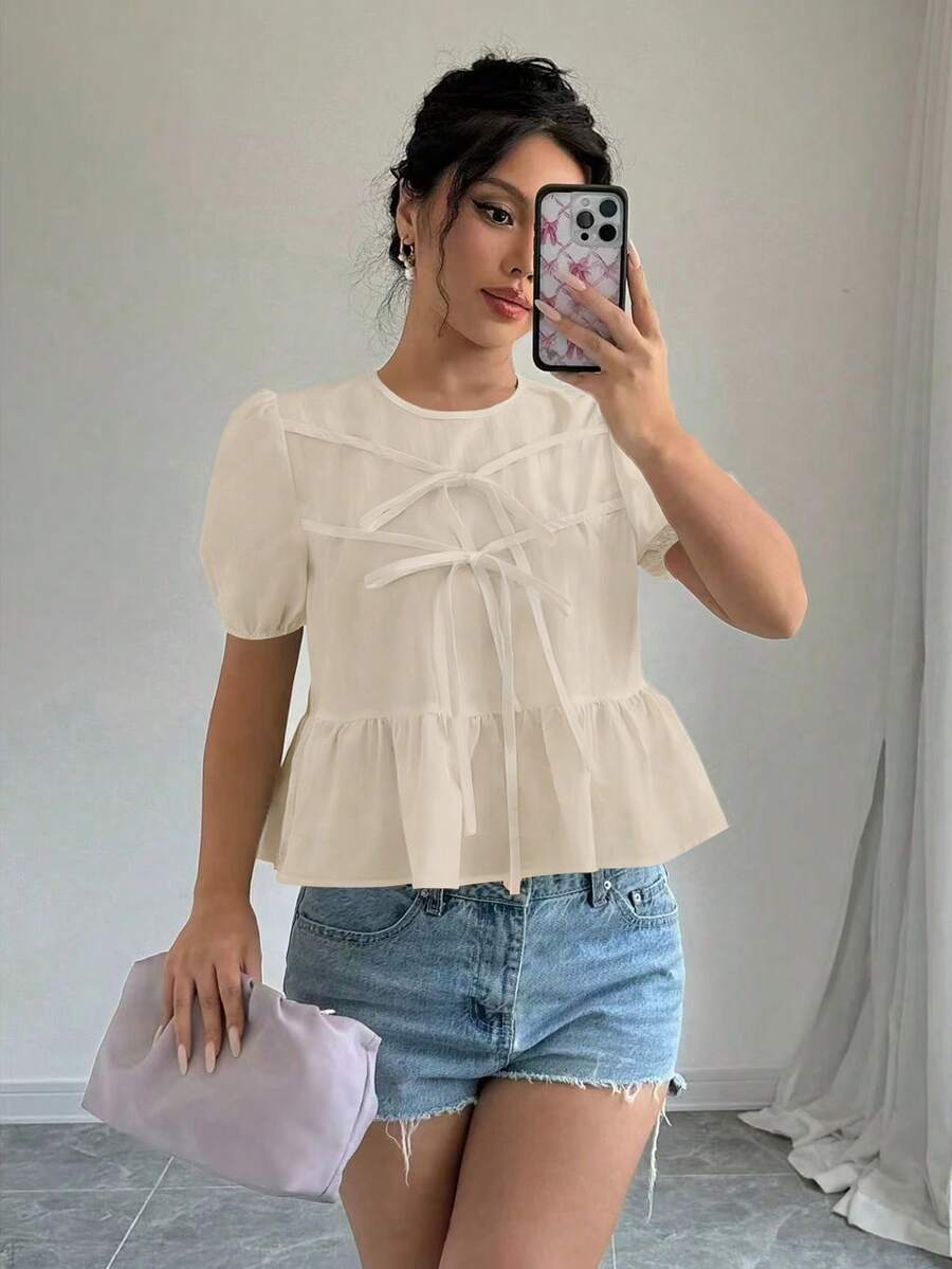 Elenzga Blusa feminina de verão, cor sólida, gola redonda, manga curta bufante, laço frontal, estilo babydoll, branca, com babados, creme, com laço frontal, estilo babydoll. Blusa feminina marfim. Blusa feminina branca. Roupas femininas. Blusas femininas de verão. Blusas femininas fofas para o verão. Blusas femininas casuais. Blusas femininas elegantes. Novidades em blusas femininas. - Damasco - Ver 1