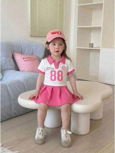 SHEIN 2 Pcs /Baby Girl Toddler/New Born 0-3 Years Old Spring/Summer Casual College Sporty Style V-Neck Polo Neck Short Sleeve Tee Shirt Top Pleated Skirt Set Baby Spring/Summer Se