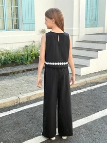 SHEIN Bộ đồ thể thao thường ngày cho bé gái tuổi teen, màu đen, cổ tròn, không tay, viền gấu, gồm áo ôm sát và quần ống rộng suông, 2 món. - màu đen - Xem 5
