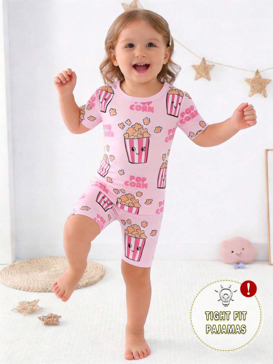 Bộ đồ ngủ 2 mảnh gồm áo thun ngắn tay cổ tròn và quần đùi màu hồng dễ thương, thiết kế đơn giản đáp ứng nhu cầu hàng ngày của trẻ, thoải mái và thoáng mát, dành cho bé gái. - trắng - Xem 1