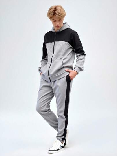 Conjunto de pants deportivo y casual para hombre, colores lisos con franja grande en la parte frontal, sin estampados. Pants de ajuste regular con bota semientubada, talle de cintura natural, bolsillos laterales funcionales con cremallera. Sudadera deportiva, cuello redondo con capucha, silueta de ajuste regular, cierre con cremallera y bolsillos frontales funcionales. Interior afelpado ligero, cálido y cómodo, ideal para hacer deporte al aire libre, caminata en el parque o para el uso casual.