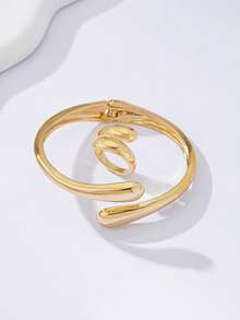 Arave 两件套（1个手镯和1个戒指）：时尚开放式不对称双水滴交叉手镯和别致的几何水滴复古金戒指。精致、甜美、优雅的风格，简约复古的设计。欧美风格，高端大气。非常适合日常佩戴、工作、会议、派对、浪漫约会、拍照、商务谈判或任何其他优雅场合，海滩、度假、夏季珠宝套装 - 金黃色 - 查看 6