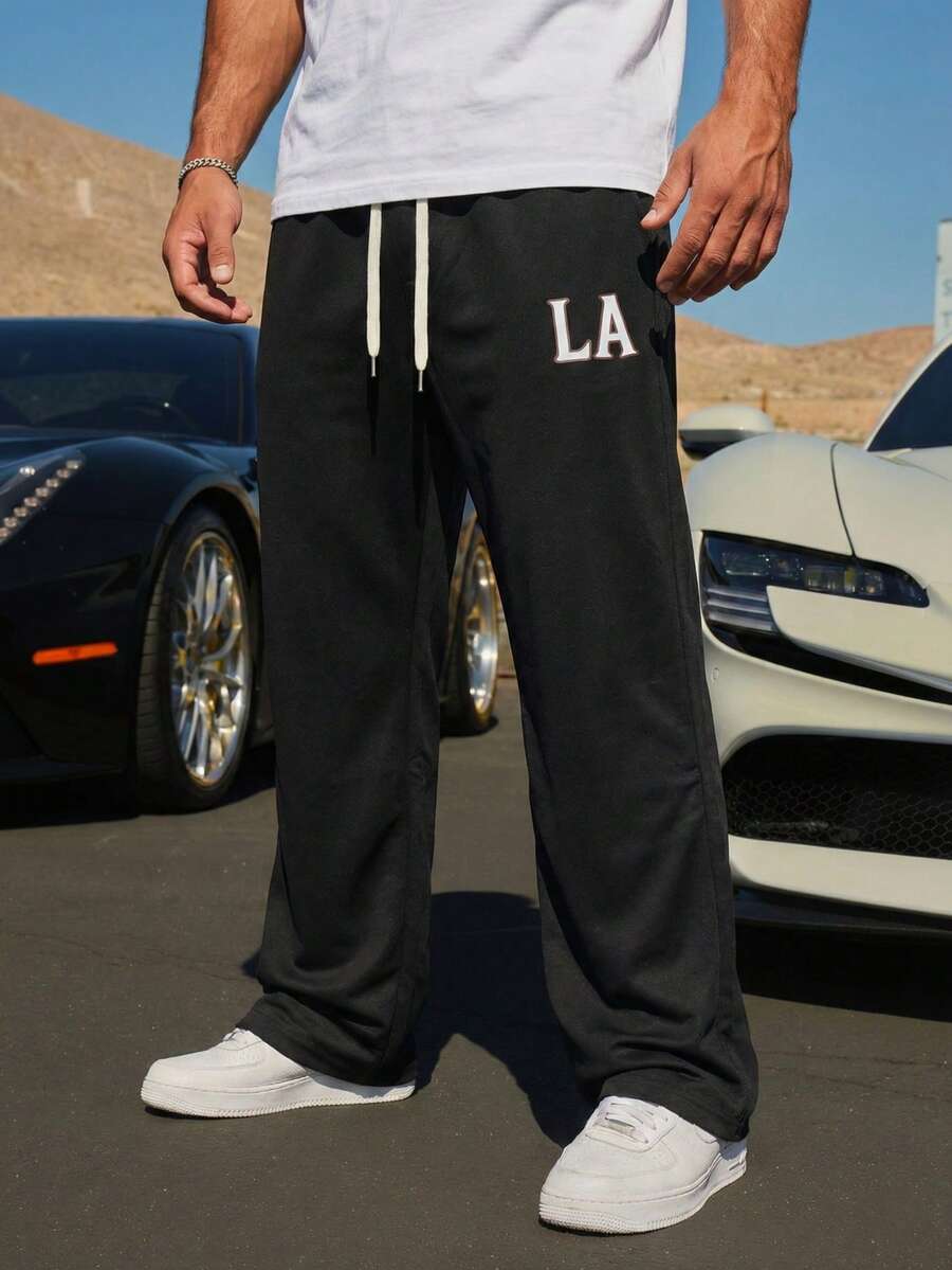 Manfinity Homme Pantalones casuales versátiles para hombres con estampado de letras y cintura con cordón - Negro - Ver 1