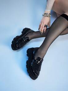 Black snakeskin shiny leather