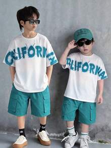 2pcs/Set Tween Boy White Summer Casual Graphic City Break Korean Style Loose Fit Round Neck Short Sleeve T-Shirt And Shorts Set For School Sports - Green - View 7